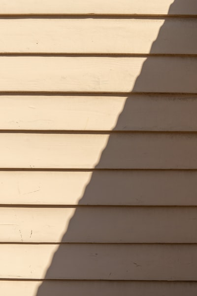 The white wooden walls during the day
